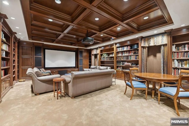 home theater room with beam ceiling, wooden ceiling, coffered ceiling, crown molding, and light colored carpet