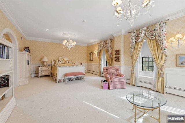 carpeted bedroom featuring ornamental molding, baseboard heating, and a chandelier