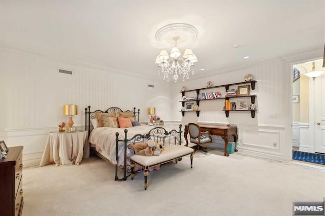 carpeted bedroom featuring a notable chandelier