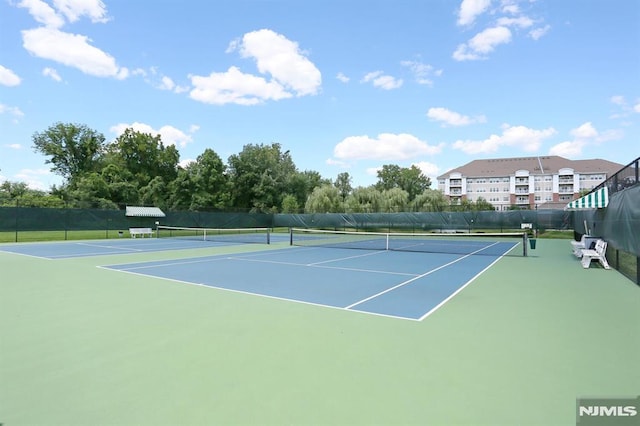 view of sport court with basketball hoop