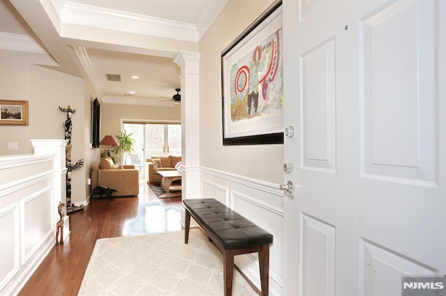 interior space with hardwood / wood-style floors and crown molding