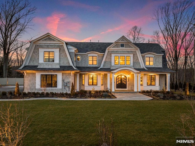 view of front of house with a yard