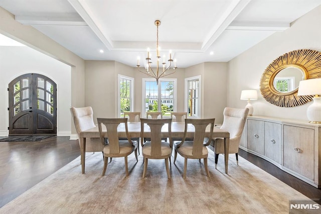 dining space featuring french doors, an inviting chandelier, and wood-type flooring