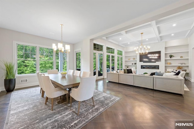 dining room featuring built in shelves, coffered ceiling, dark parquet floors, beamed ceiling, and a chandelier