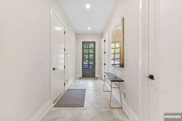 entryway featuring light tile patterned floors