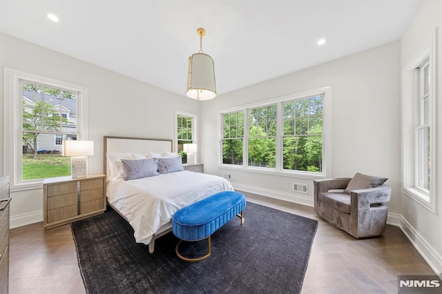 bedroom with dark parquet floors