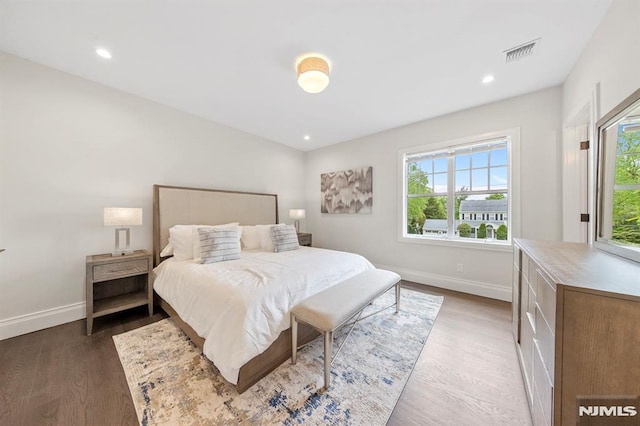 bedroom featuring dark hardwood / wood-style flooring