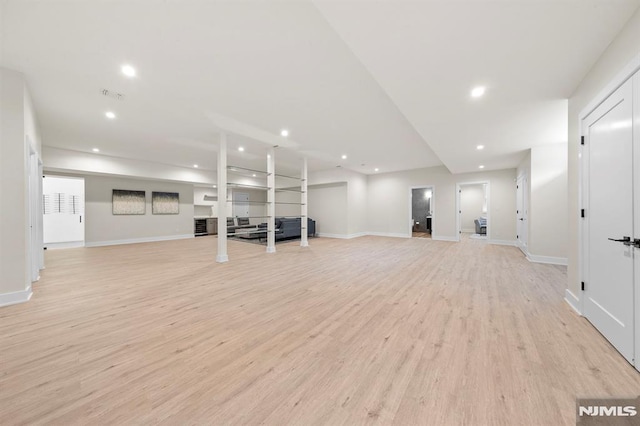 exercise area featuring light hardwood / wood-style floors