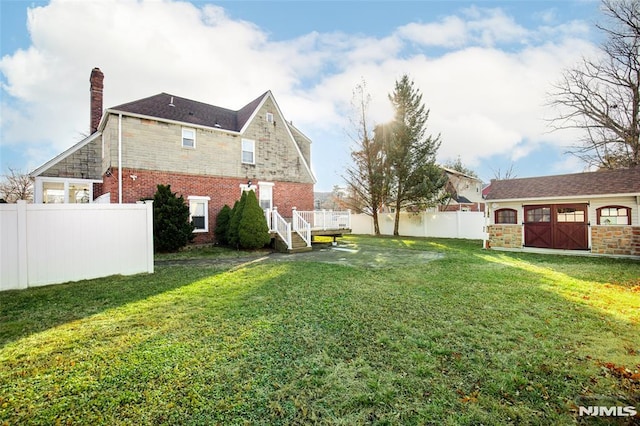 view of yard featuring a wooden deck