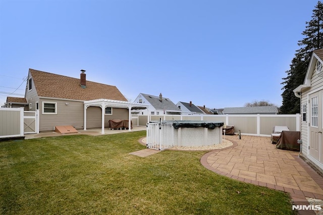 view of yard with a pergola, a patio, and a covered pool