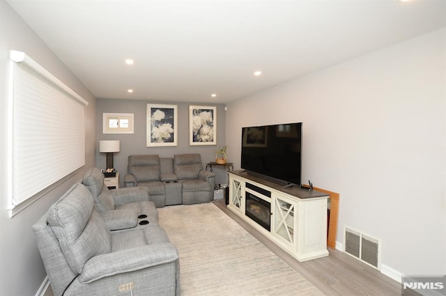 living room with light hardwood / wood-style floors