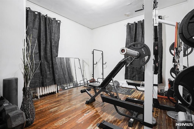 workout area with wood-type flooring