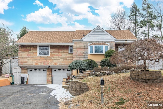 view of front of property featuring a garage