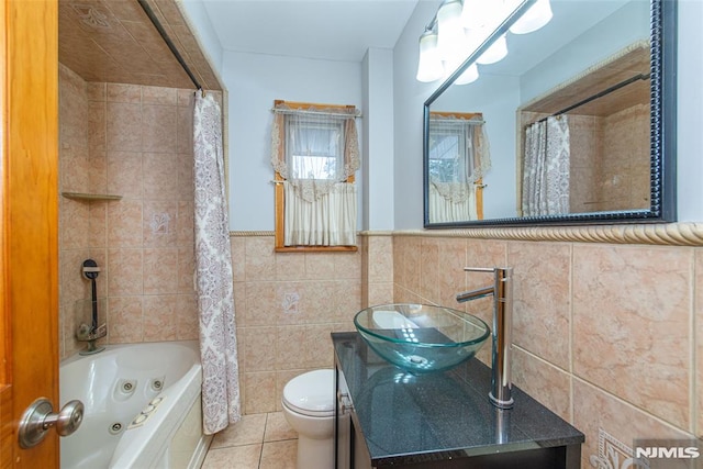 full bathroom with toilet, tile walls, tile patterned floors, shower / bath combo, and sink