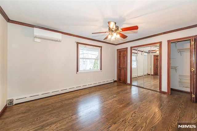 unfurnished bedroom featuring baseboard heating, multiple closets, ceiling fan, a wall mounted air conditioner, and dark hardwood / wood-style floors