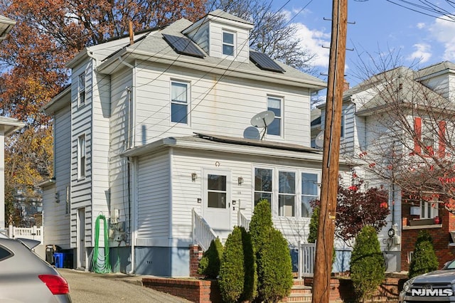 view of front of home with solar panels