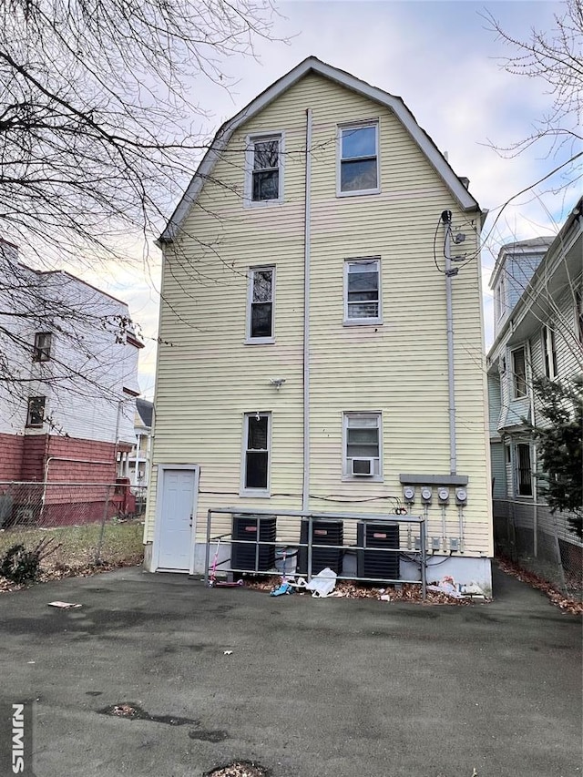 rear view of house with cooling unit