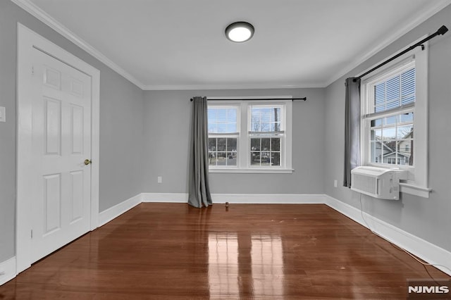 spare room with hardwood / wood-style flooring, cooling unit, and ornamental molding