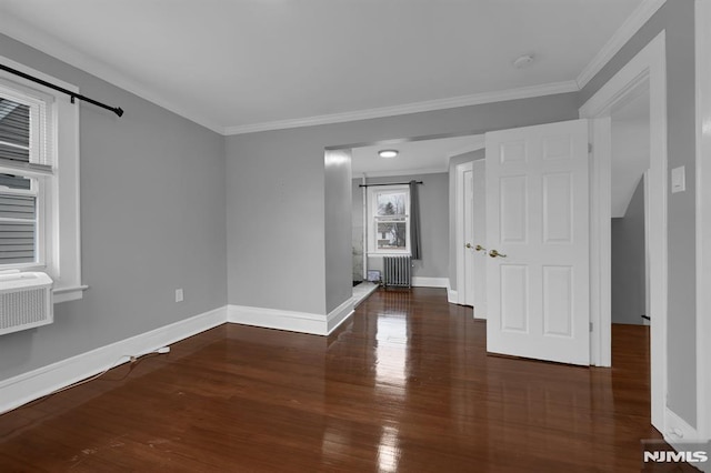 unfurnished room with radiator, crown molding, and dark hardwood / wood-style floors