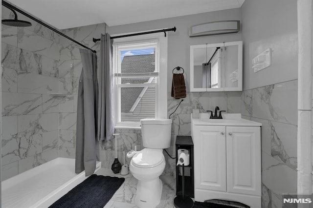 bathroom with vanity, toilet, walk in shower, and tile walls