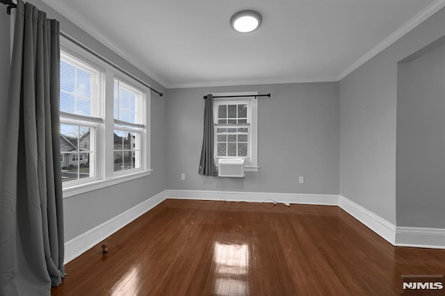 spare room with hardwood / wood-style flooring, cooling unit, and ornamental molding