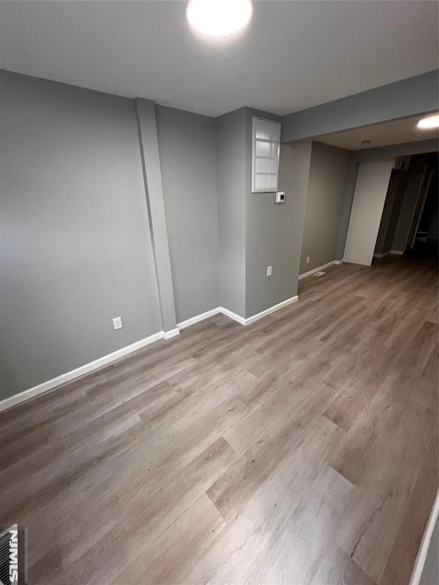 basement featuring hardwood / wood-style floors