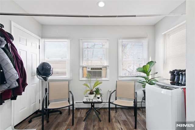 interior space featuring plenty of natural light, cooling unit, and dark hardwood / wood-style flooring