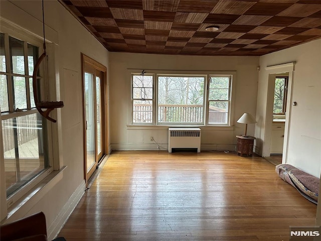 interior space featuring light hardwood / wood-style flooring and radiator heating unit