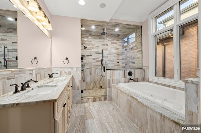 bathroom with tile walls, tile patterned floors, plus walk in shower, and vanity