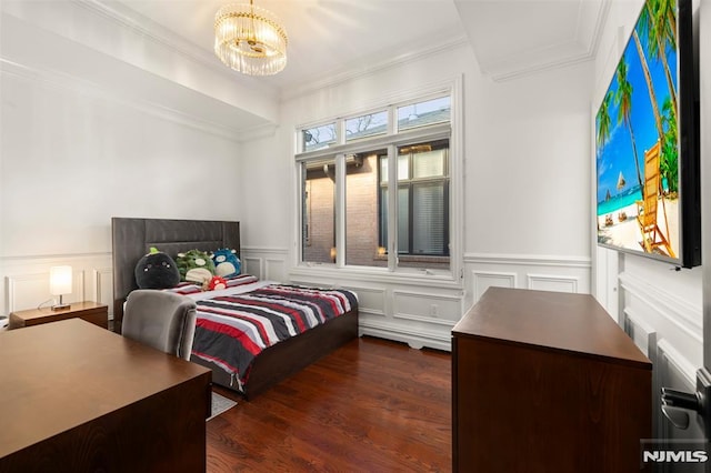 bedroom with dark hardwood / wood-style flooring and an inviting chandelier