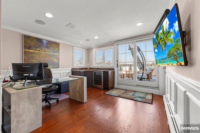 office area featuring beverage cooler, baseboard heating, crown molding, and dark hardwood / wood-style floors