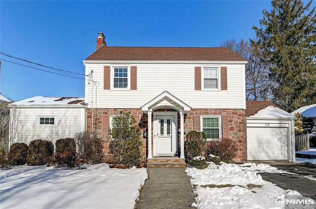 colonial home featuring a garage