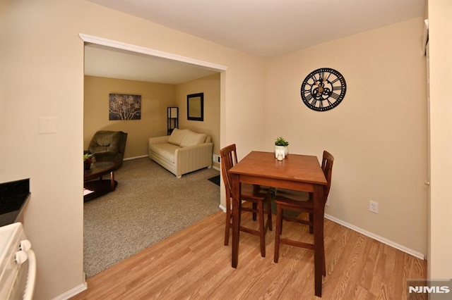 dining area with light hardwood / wood-style flooring