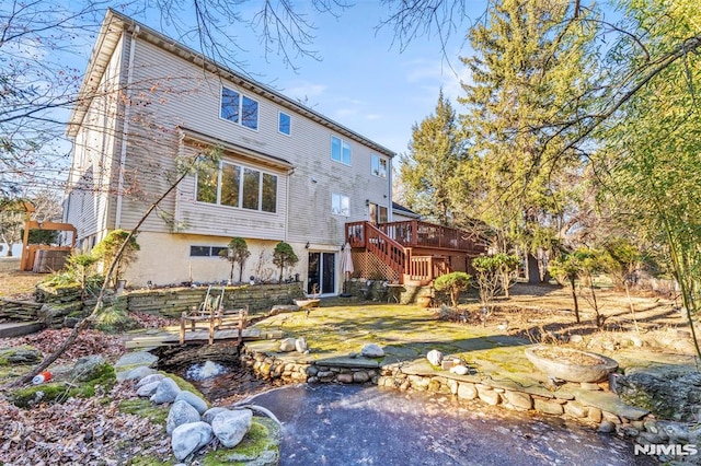 rear view of property with a deck