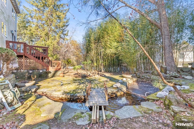 view of yard with a wooden deck