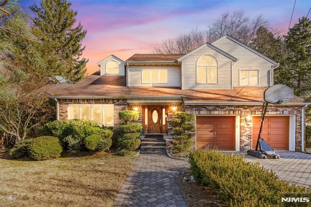 view of front of property with a garage