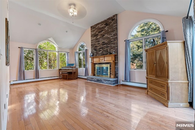 unfurnished living room featuring a fireplace, baseboard heating, vaulted ceiling, and light wood-type flooring