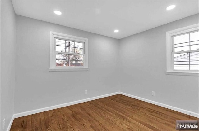 empty room featuring hardwood / wood-style flooring