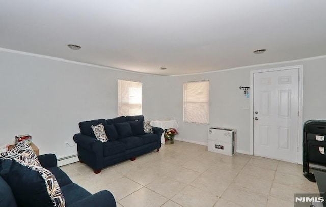 living room with baseboard heating, ornamental molding, and light tile patterned flooring