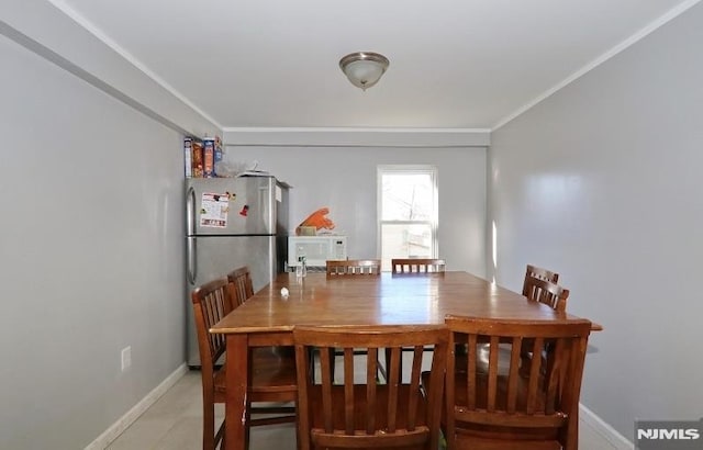 dining area featuring crown molding