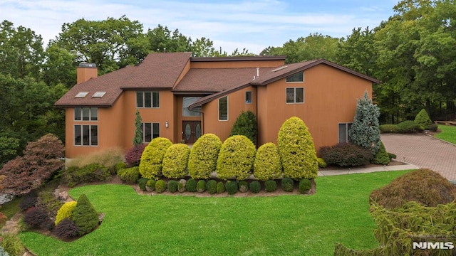 view of property exterior featuring a yard