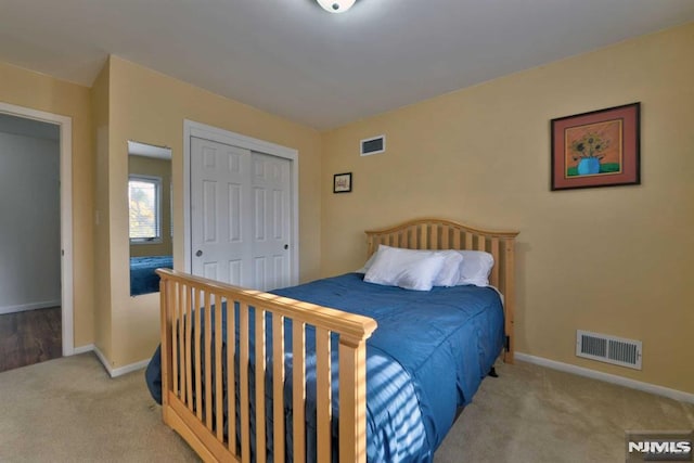 carpeted bedroom featuring a closet