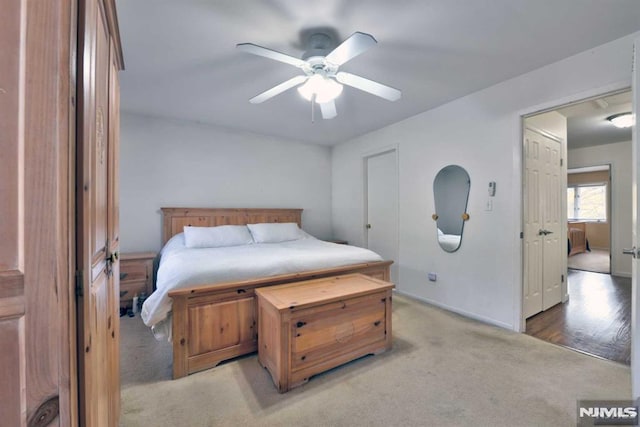 carpeted bedroom featuring ceiling fan