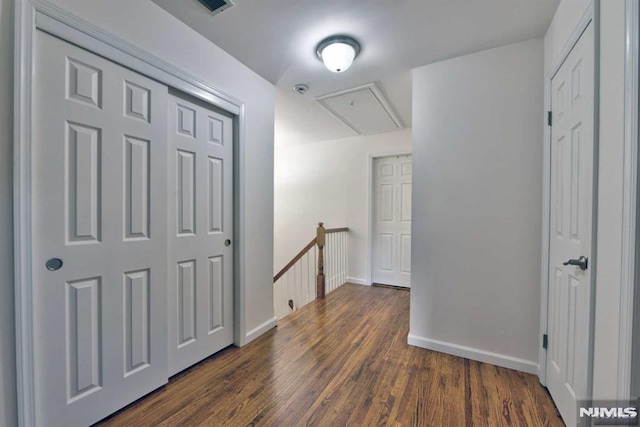 corridor featuring dark hardwood / wood-style floors