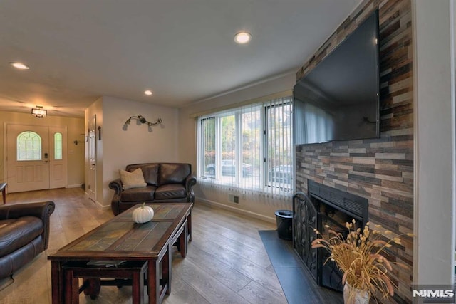 living room featuring a fireplace and hardwood / wood-style flooring