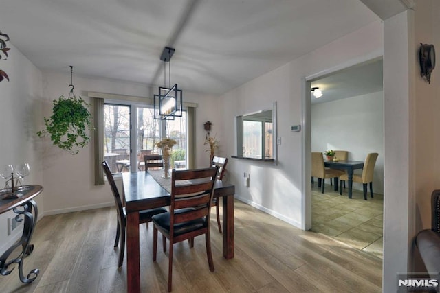 dining space featuring hardwood / wood-style flooring