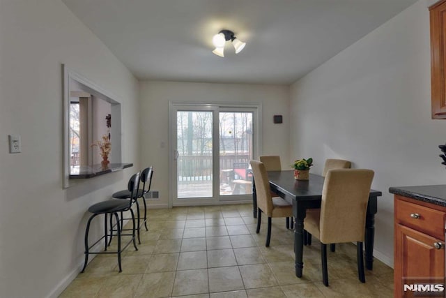 view of tiled dining space