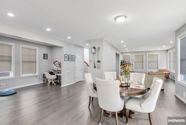 dining space with dark wood-type flooring