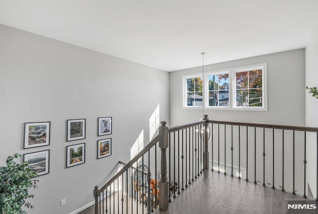 stairs with wood-type flooring