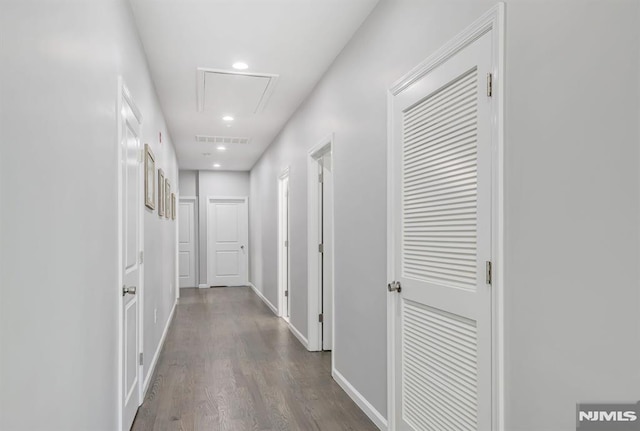 corridor with dark hardwood / wood-style floors